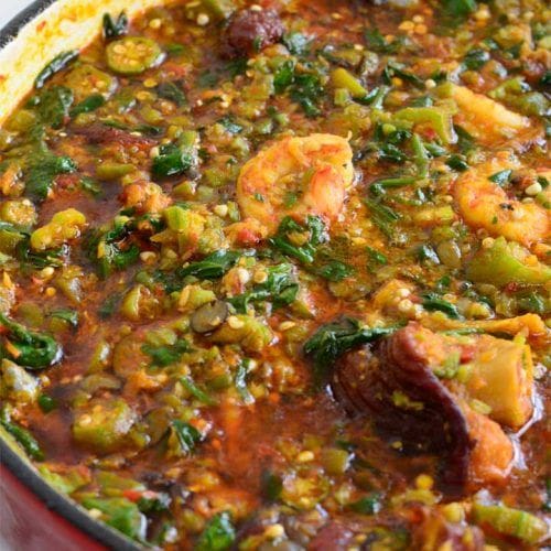 A bowl of okra soup, a Nigerian dish featuring okra pods, and assorted meat